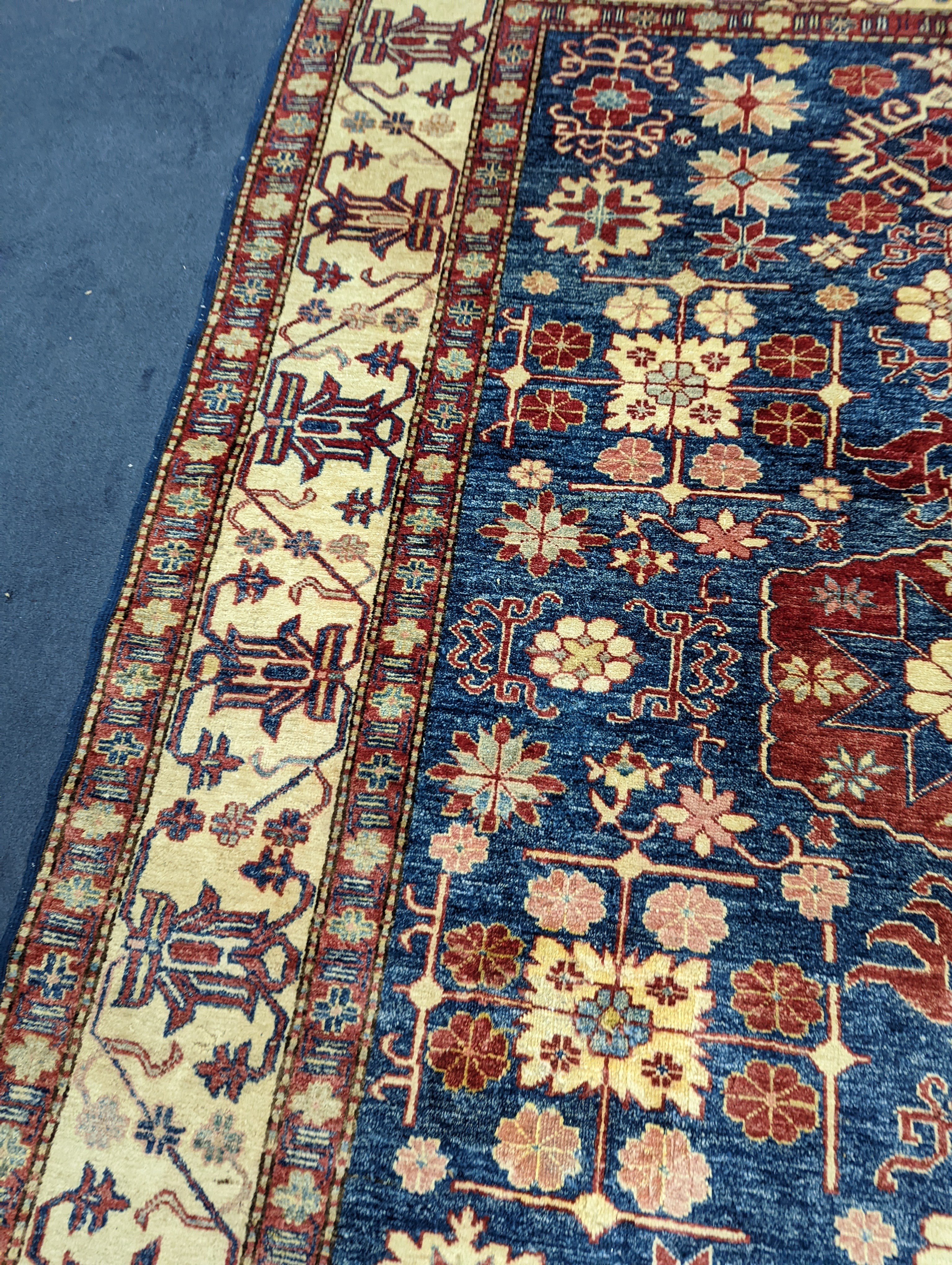 A Kazak blue ground carpet, 242 x 186cm